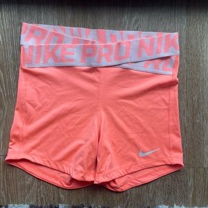 Coral x waistline Nike Pro shorts